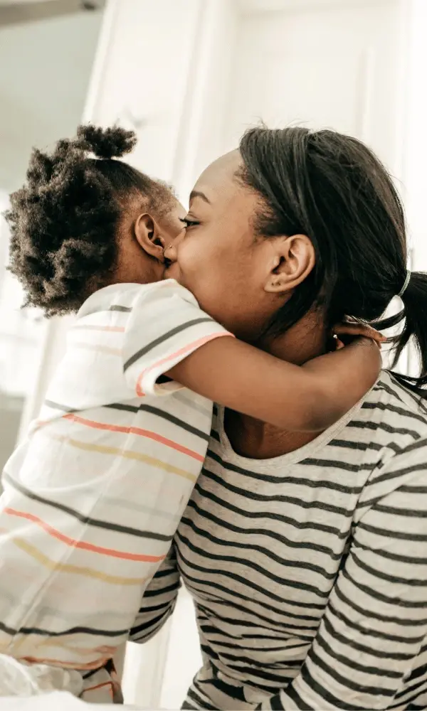 A mother recieves a warm hug from her one year old child